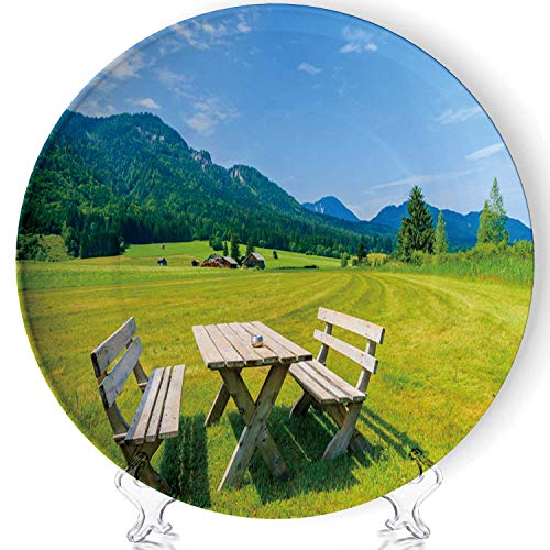 Wooden picnic table with benches on green meadow in summer landscape of Weissensee lake Art Fashion DColorfulrative Ceramic Plates Display Plate Craftswith Stand for living room of the home8