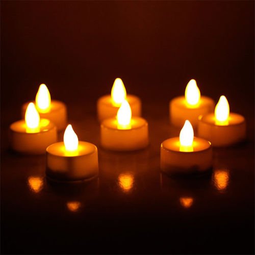 24 Flameless Battery Christmas LED Tea Light Flickering Amber Tealights Candles