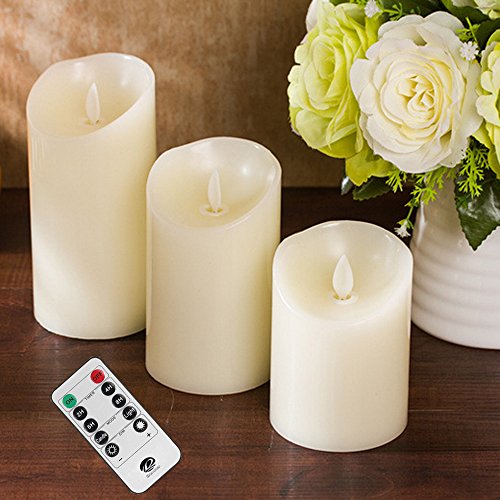 Haoran Ivory Real Wax Pillars Votive Candles Battery Operated LED Lighted Realistic Flickering Flameless Candles Set with 10-Key Remote Timer Set of 3 Amber Yellow Timer and Dimmer Options