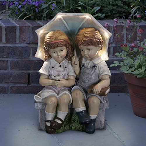 Exhart Solar Boy and Girl Statue wUmbrella Hand Painted Children Garden Statues wSolar LED Lights  Durable Resin Garden Sculptures  Statues  Girl and Boy Statue (9 L x 11 W x 17 H)